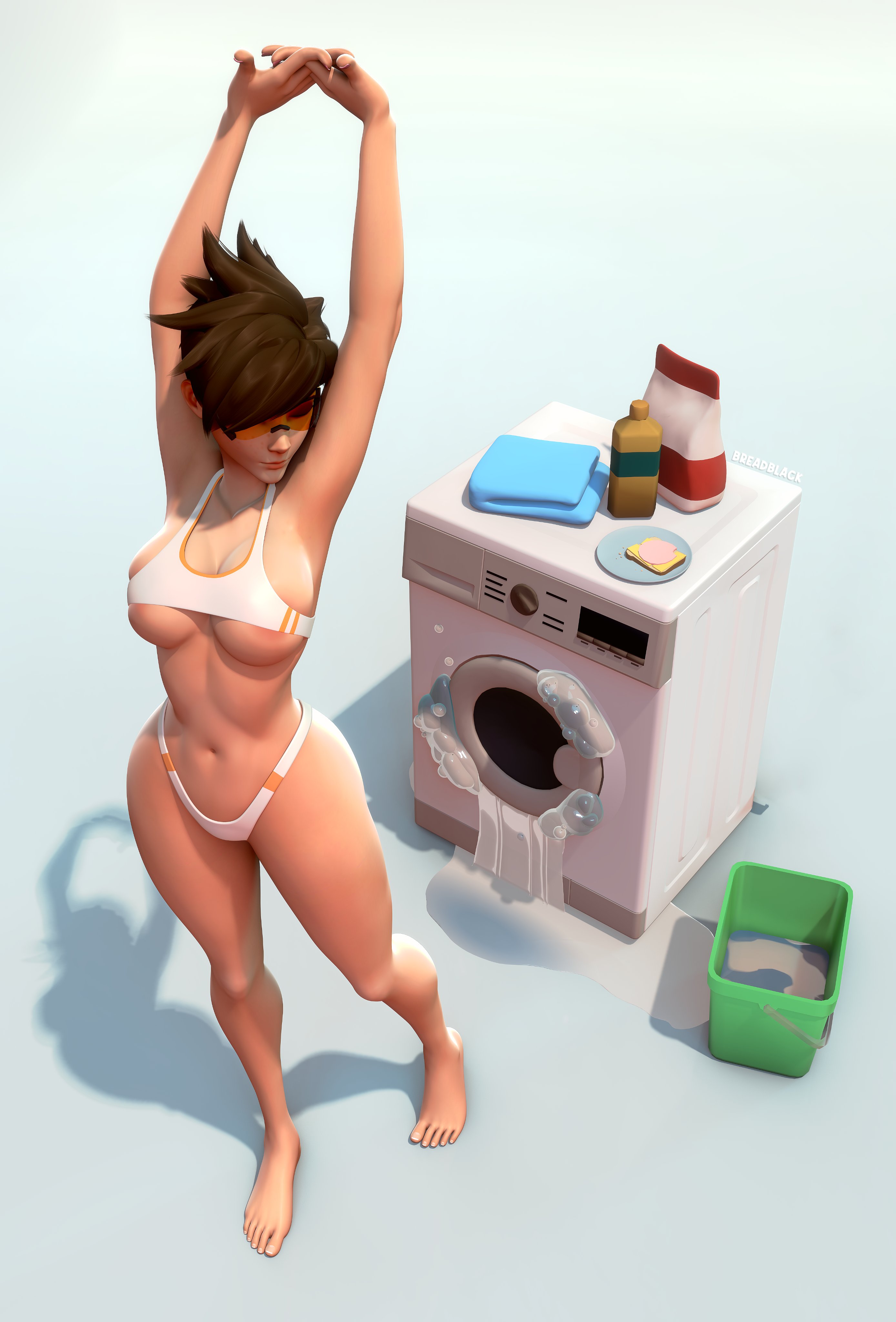 Tracer washing clothes with arms up.